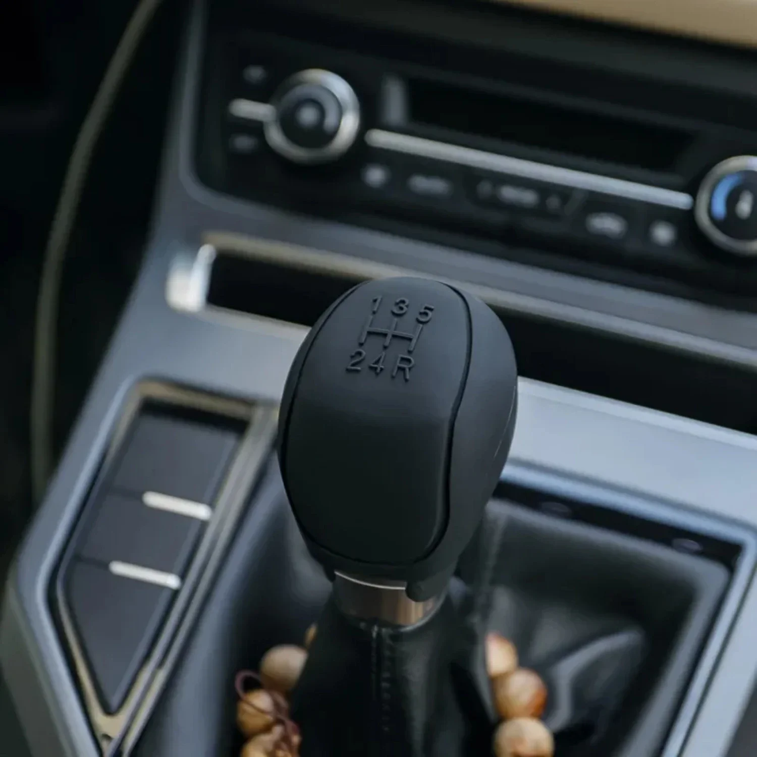 this luxurious and fashionable car handbrake gear knob cover. The high-quality silicone material ensures durability and a comfor