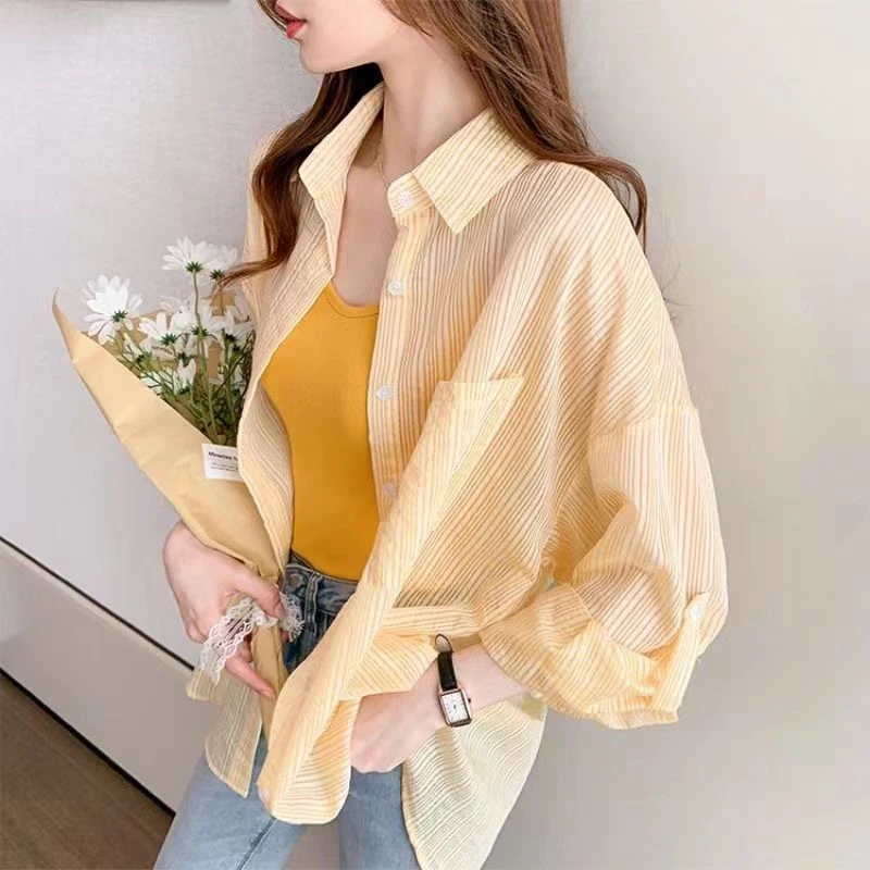 

Fashion Lapel Button Loose Pockets Striped Shirt Female Clothing 2025 Spring Summer New Casual Tops Asymmetrical Korean Blouse