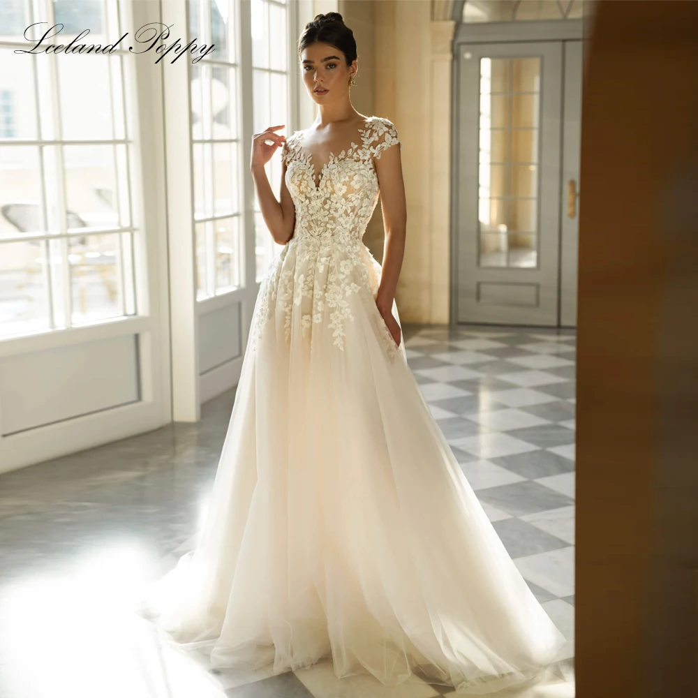 

Lceland Poppy Customized A Line Lace Wedding Dresses Illusion Bridal Gowns with Cap Sleeves