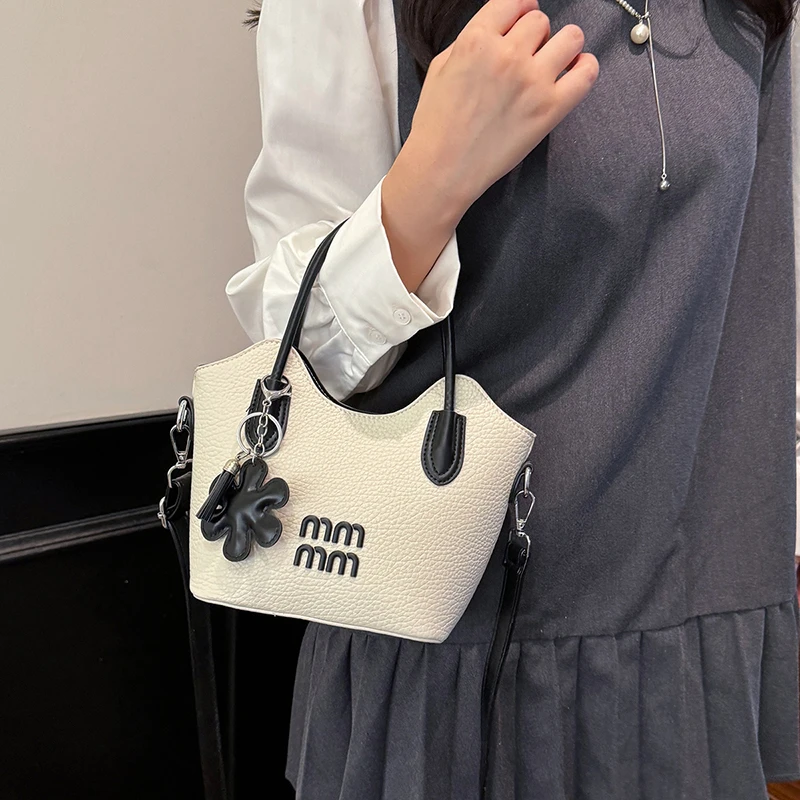 

Elegant Leather Classic Minimalist Clutch Bag for Women with Solid Color Letter Logo and Fashionable Designer Touch