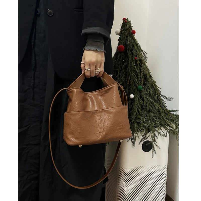 

Bag Girl 2025 New Iarge-Capacity Handbag With A High-end Feel Niche Commuting Hand-held Pattern Crossbody Bucket Bag.