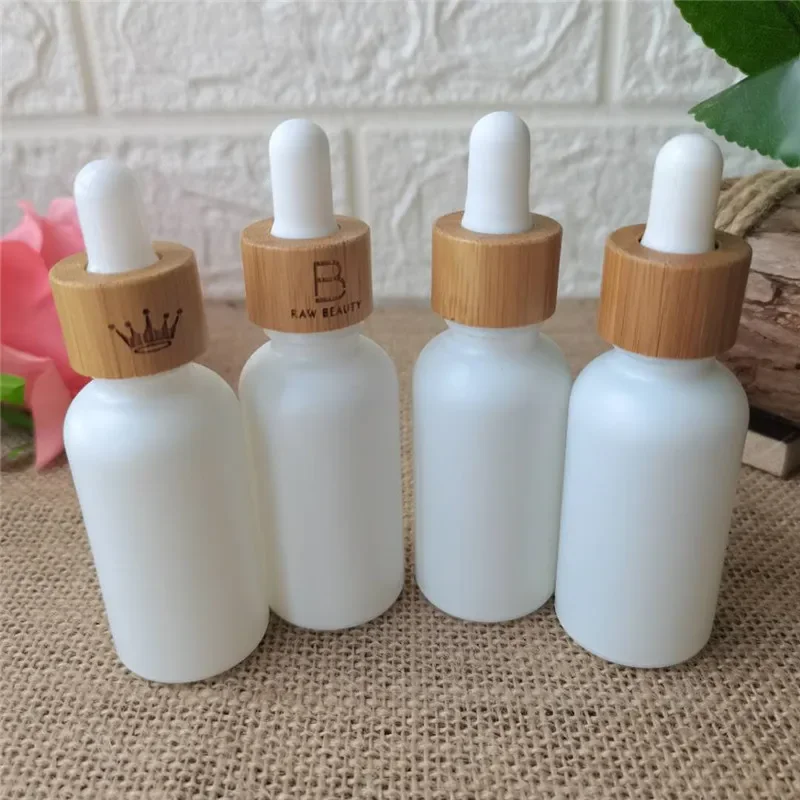 

Wholesale fashionGlass flat shoulder Matte White Essential Oil Bottle Frosted Bamboo Dropper Pot Women Cosmetic Container Sample