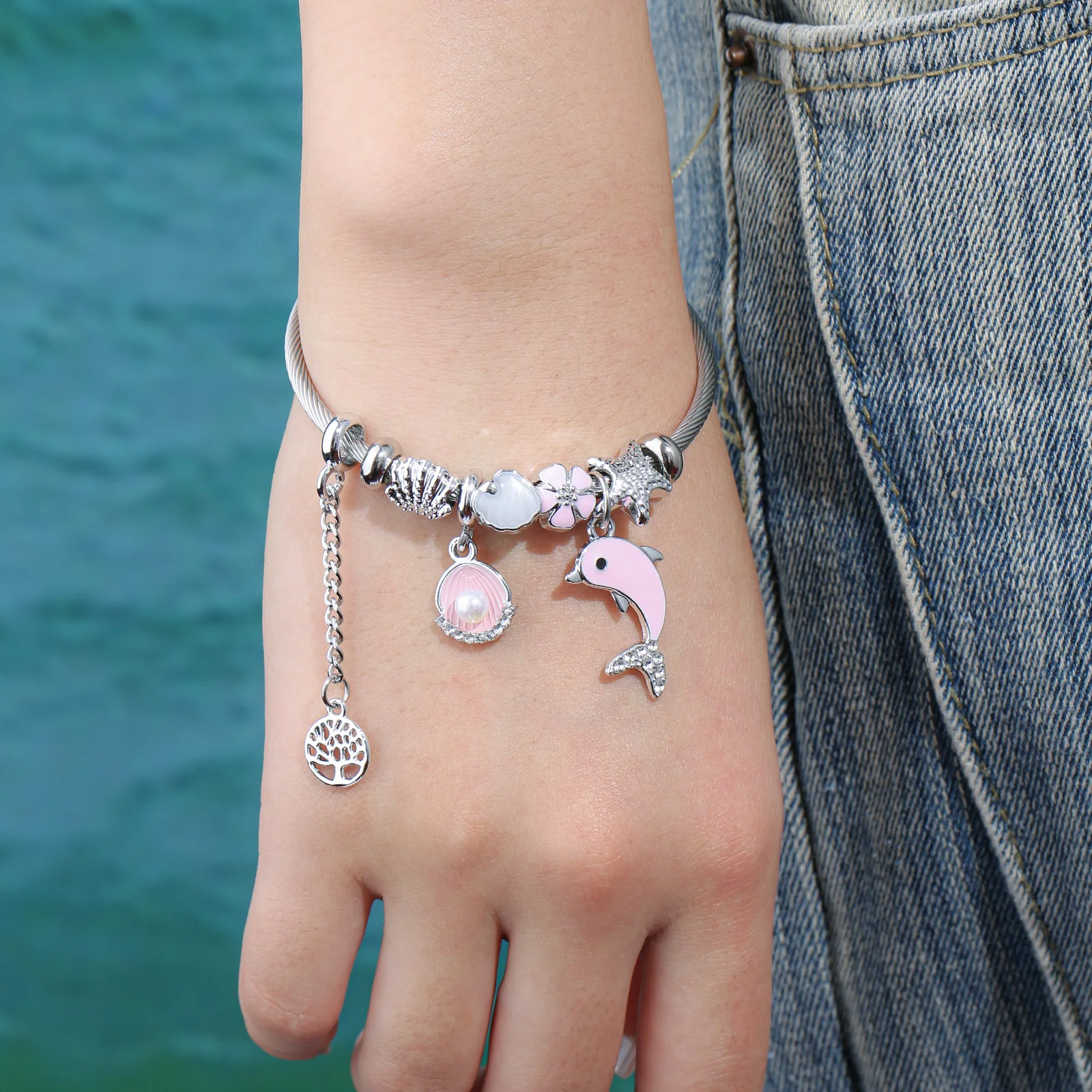 Silver Tone Ocean Theme Charm Bangle with Pink Dolphin and Shell Pendants for Women