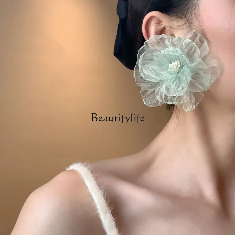 

Holiday wind simulation flower seaside green flower exaggerated earrings design sense premium stud earrings