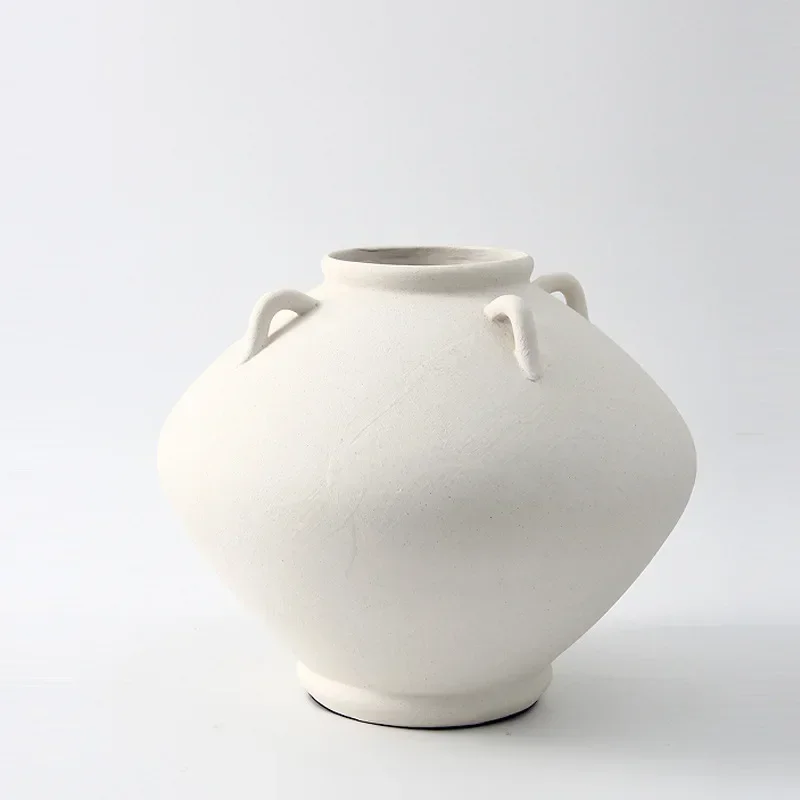 Simple medieval ceramic jar vase, soft-packed dried flower utensils at the sales office of the home model room