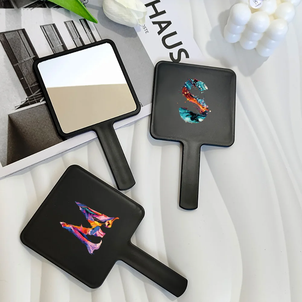 

1pc Handheld Makeup Mirror Square Portable Dual-Use Stylish Paint Pattern Women's Daily Essential Initial Name 26 Letter Pattern