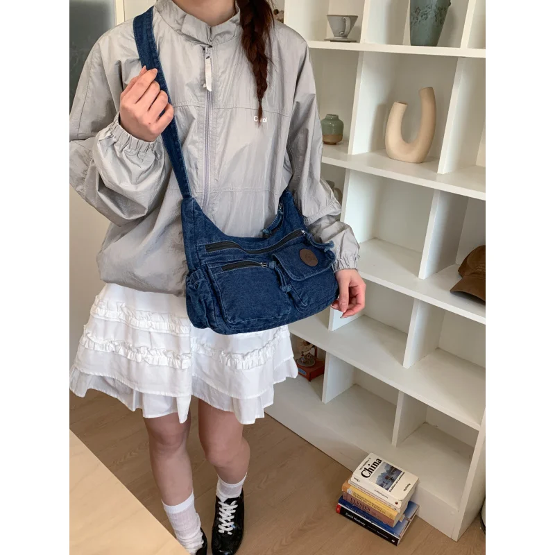 

Japanese-style multi-pocket washed denim large-capacity women's bag2026New casual versatile shoulder and crossbody bag
