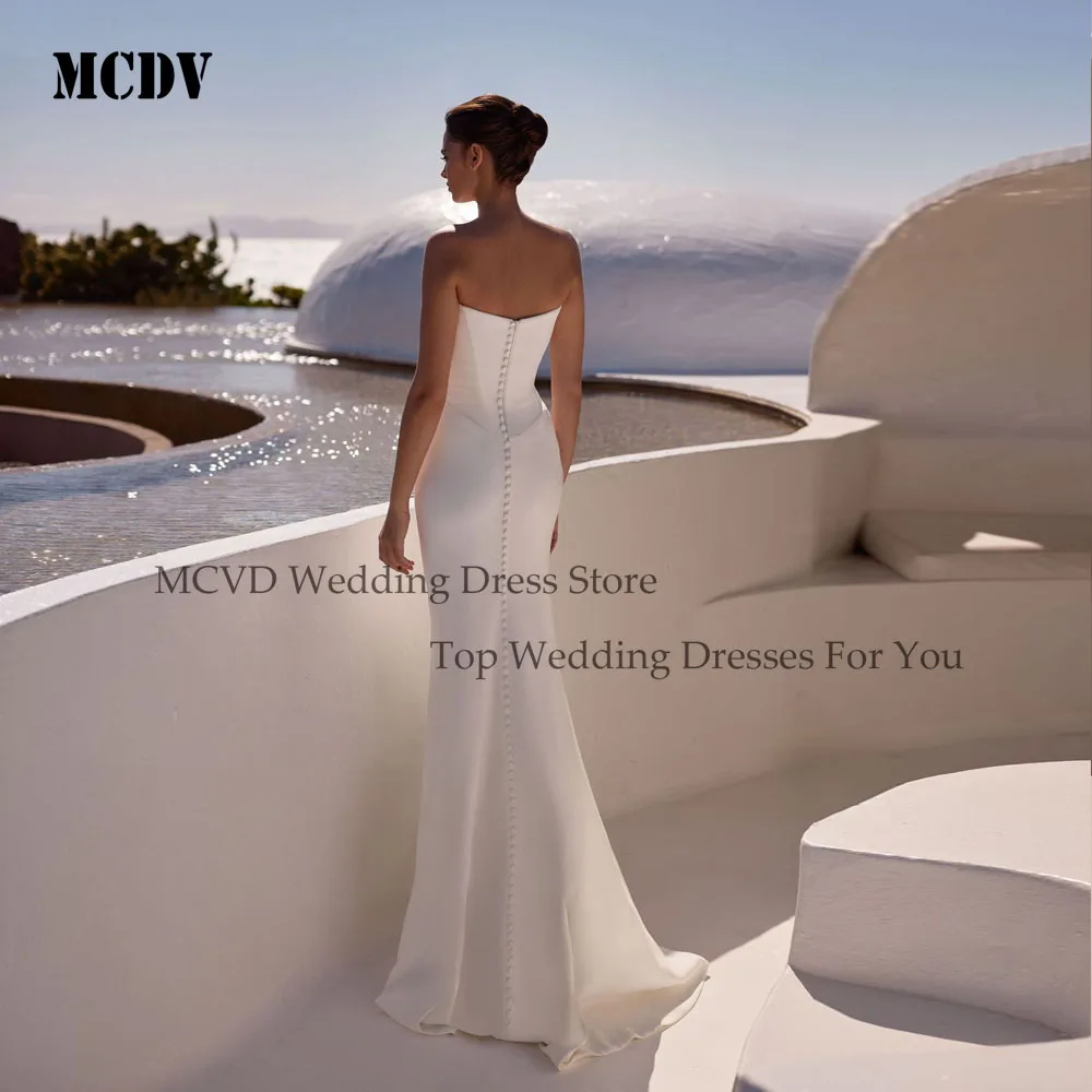 فساتين زفاف MCDV مخصصة بدون حمالات بطيات 2025 حورية البحر بأزرار خلفية بدون أكمام من الساتان فستان العروس عاجي فيستدوس دي نوفيا