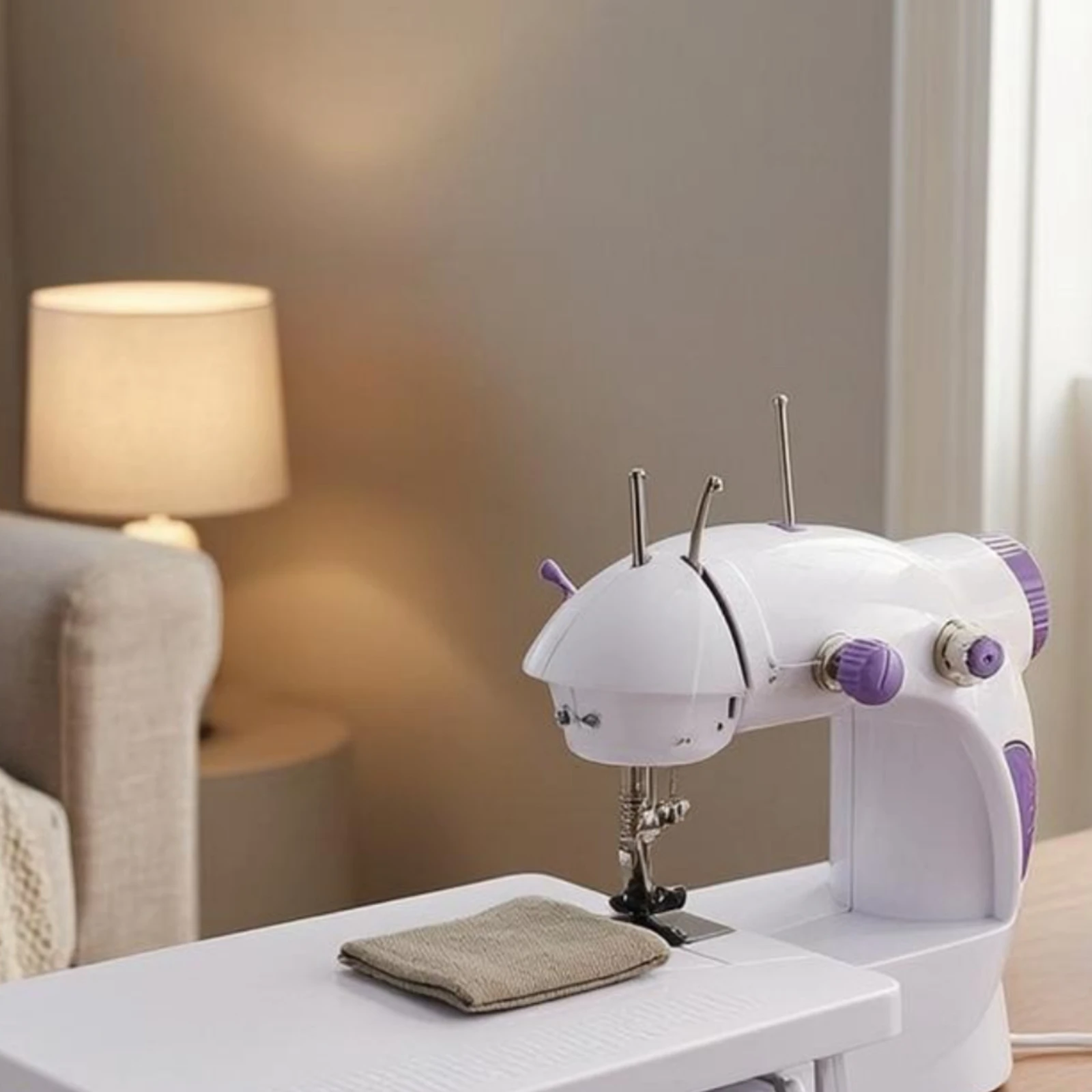 

Electric Sewing Machine Foot Pedal Compact Sewing Machine White and Violet Handwheel Controls