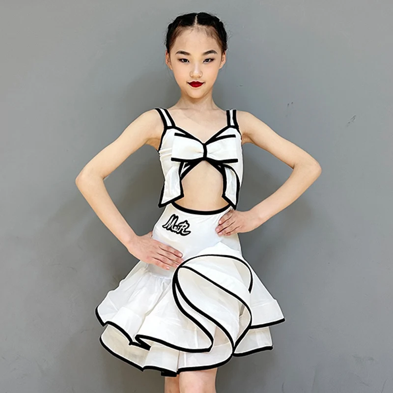 2025 Nuove Ragazze Costume di Ballo Latino Rosa Bianco Arco Top Gonna Performance Set Bambini Cha Cha Rumba Concorso di Ballo Vestito DNV22280