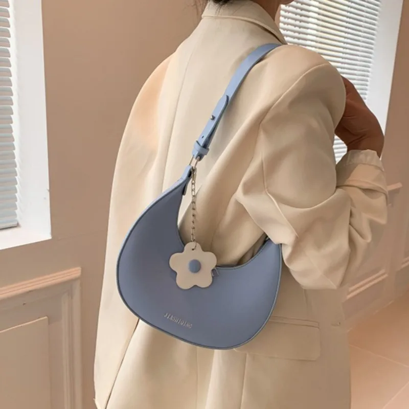 Trendy Semi-month Textured Shoulder Bag, Crescent Bag with Small Flower Pendant, Available in Various Colors