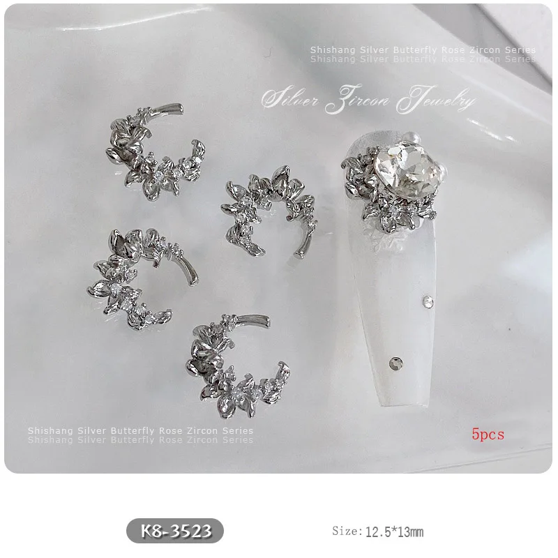 5PCS Nail Art Zircon Bowtie รูป 3D Charms โลหะเงินหรูหรา Rose ผีเสื้อโลหะอัญมณีสําหรับตกแต่งเล็บ