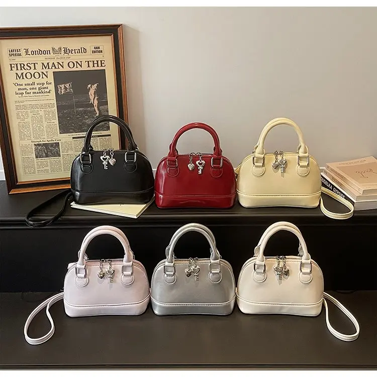 

Корейская версия портативной сумки-ракушки: модная и простая женская сумка, новинка 2026 года, повседневная сумка через плечо/мессенджер/ручная сумка