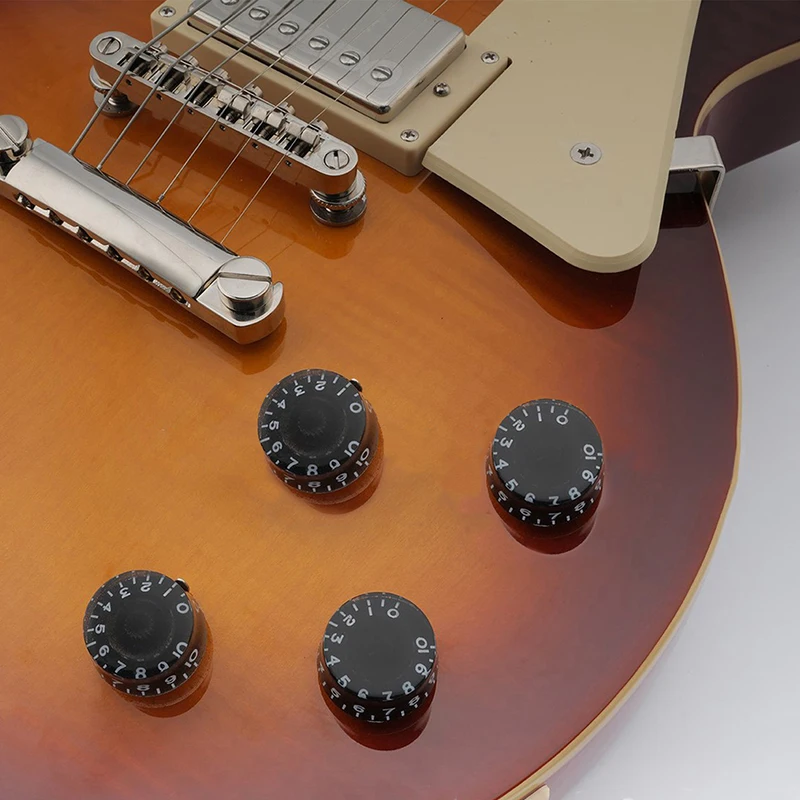 Paquete de cuatro accesorios para guitarra, perilla de volumen para bajo y guitarra eléctrica, potenciómetro, sombrero, perilla de tono LP