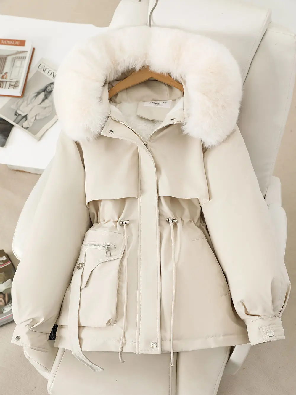 Side profile demonstrating puffer volume distribution and waist cinch effect with drawstring adjustment