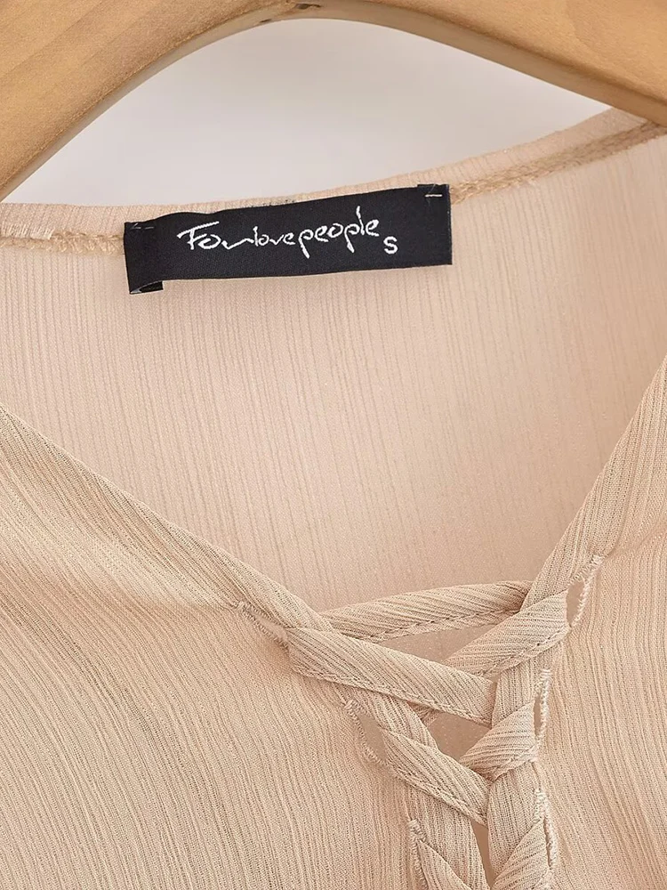 European style new women's fashion all-match temperament semi-transparent waist placket tie design trumpet sleeve top