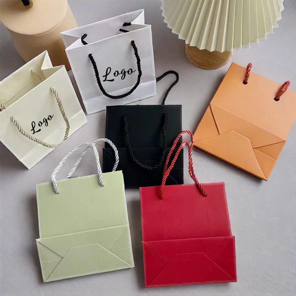 

Personalized Logo Cosmetic Perfume Jewelry Packaging Bags Luxury Shopping Ribbon Handles Watches Lipstick Gift Paper Tote Bag