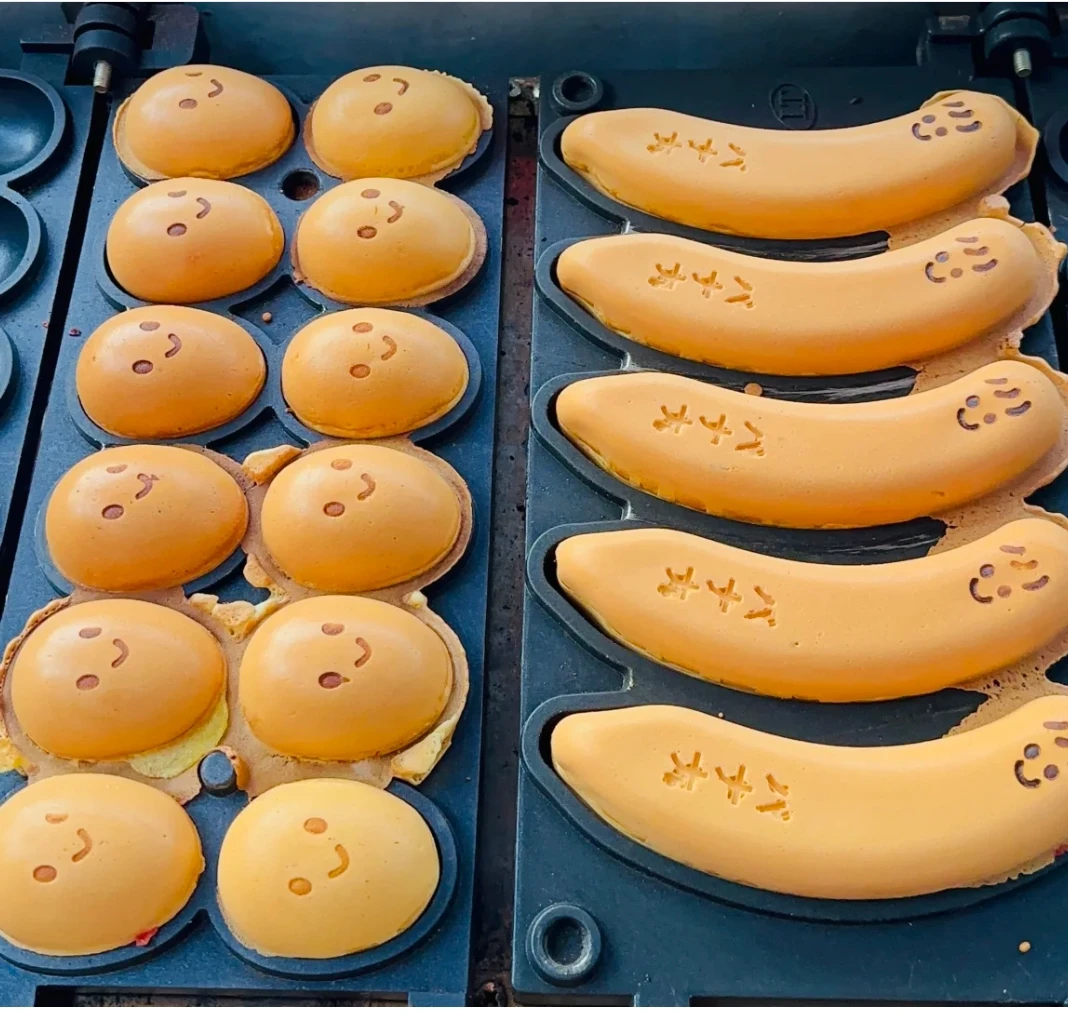 ماكينة صنع الوافل الكهربائية المصنوعة من الفولاذ المقاوم للصدأ سهلة التشغيل وآلة تحميص البيض آلات الوجبات الخفيفة الجديدة مع تصميم الابتسامة