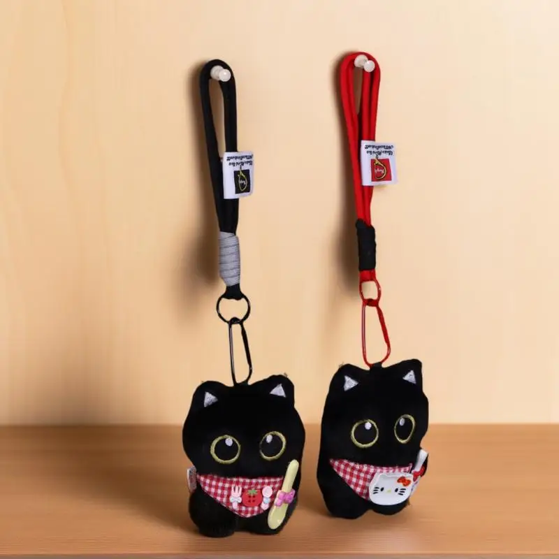Nowatorski wzór dla par: Breloczek z pluszową figurką czarnego kota do kluczyków samochodowych i akcesoriów do torebek.