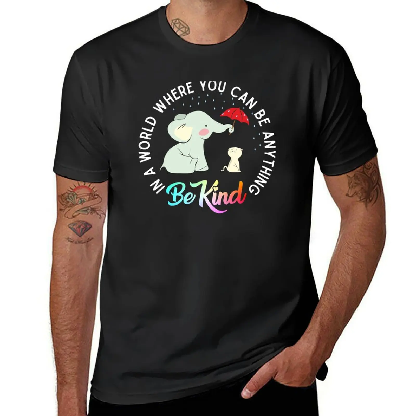 In a world where you can be anything be kind elephant holding un umbrella to protect cat form the rain T-Shirt