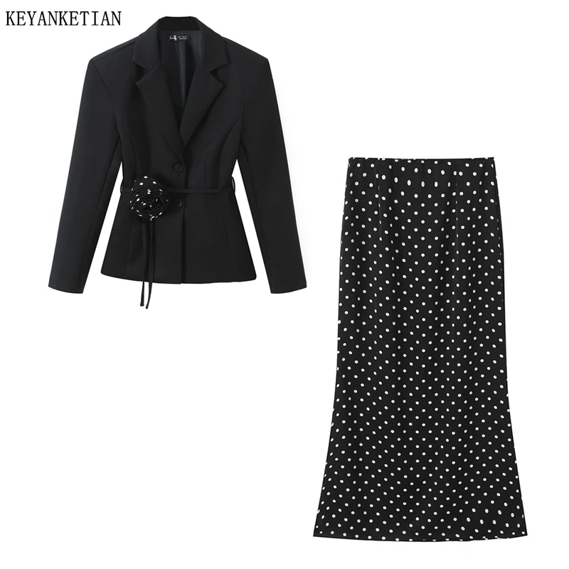 

KEYANKETIAN 2026 Новый французский ретро-костюм из двух предметов: черный блейзер с цветочным поясом + макси-юбка в горошек. Элегантный комплект.