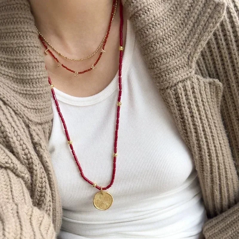 

2025 Fashion Classic European and American Luxury High end Red Agate Beads Good Luck Love Sweater Chain Fashion Banquet Gift