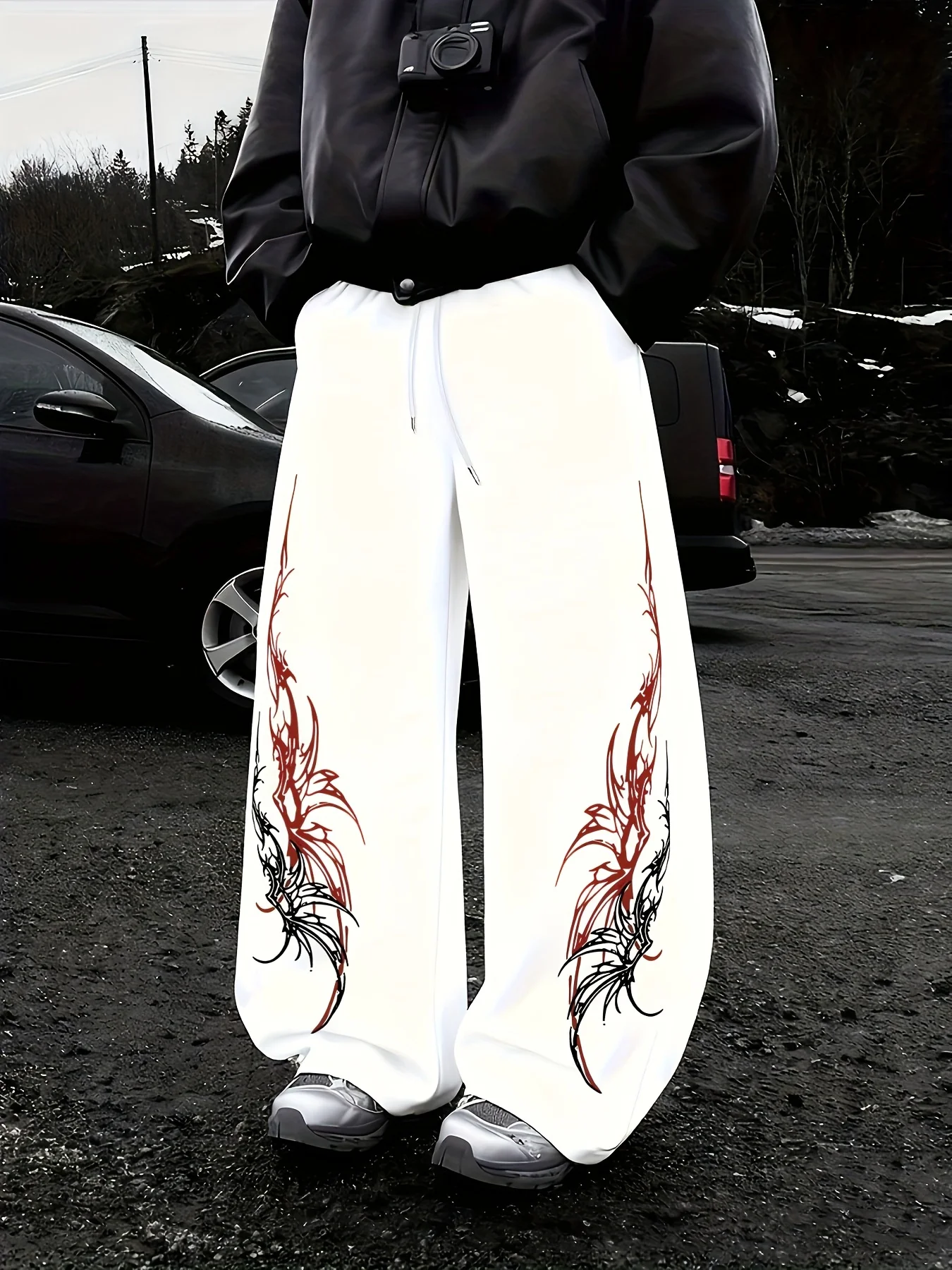 

Мужские модные и стильные спортивные брюки с узором и завязками на талии — лучший выбор для свободного, комфортного и повседневного ношения дома.