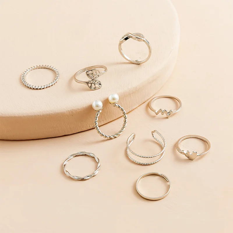 9-Piece set of pearl ring women's design sense niche ins style European and American fresh and sweet silver twist bow ring