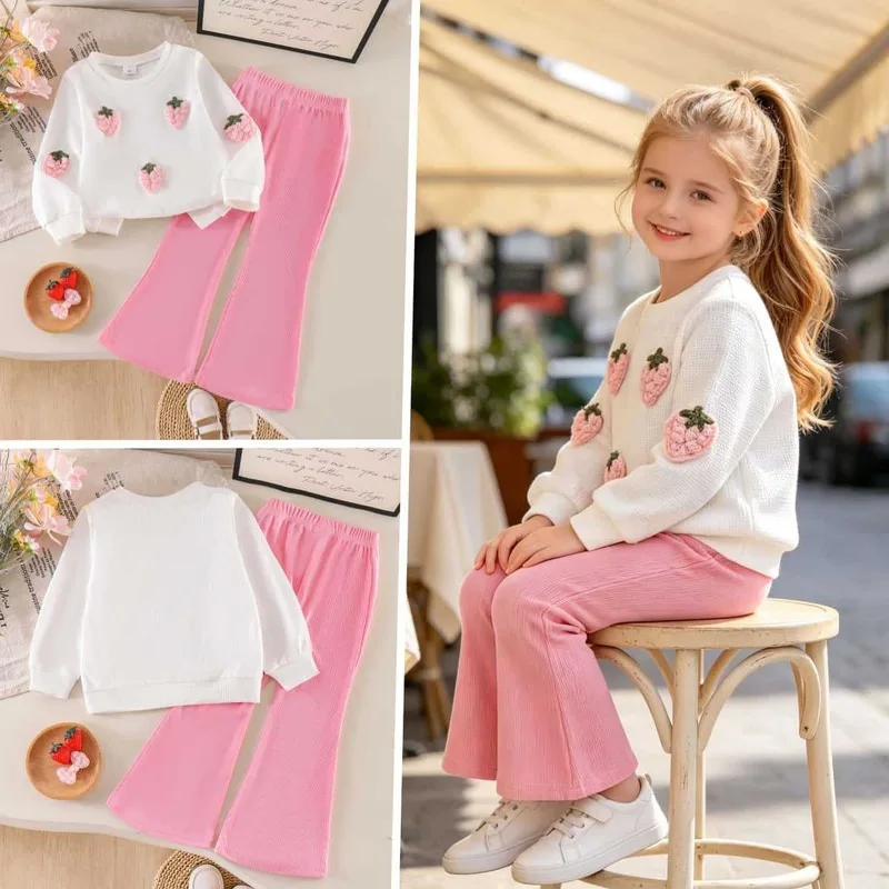 Autumn children's clothing: a pink strawberry-patterned long-sleeved top paired with solid-colored, slightly flared pants – a fr