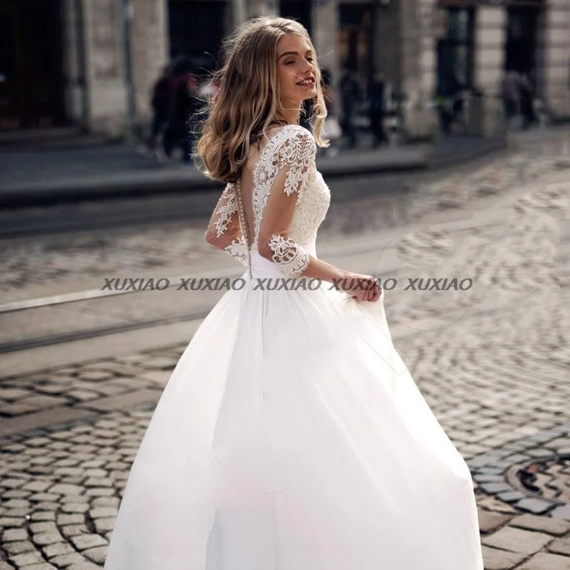 فستان زفاف بوهو مثير لعام 2025 مزين بالدانتيل ورقبة على شكل V نصف كم فساتين زفاف عصرية للشاطئ من الساتان فساتين بسيطة فيستدوس دي نويفا