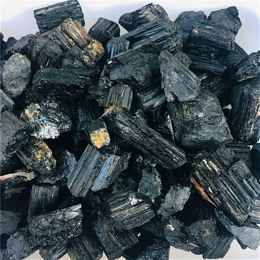 Natural black tourmaline - a genuine mineral specimen with sharp edges and a smooth surface.