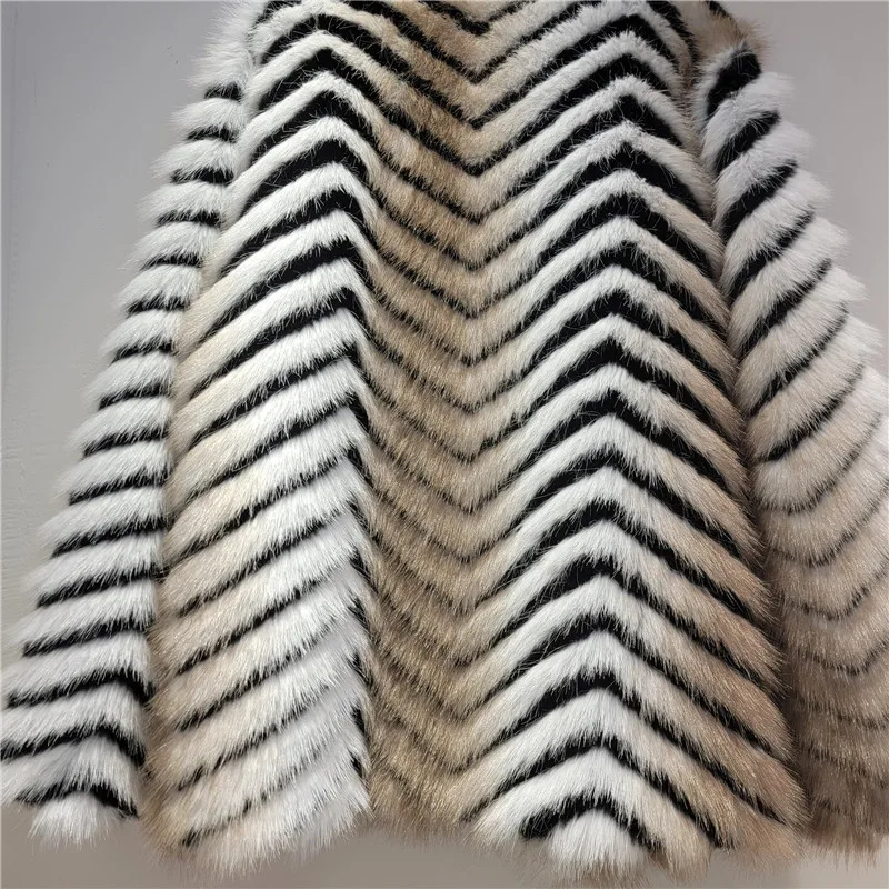 

Conscious Luxury: Our Herringbone Faux Fur Coat. Embrace timeless style with this elegant, sustainable, and cruelty-free design.