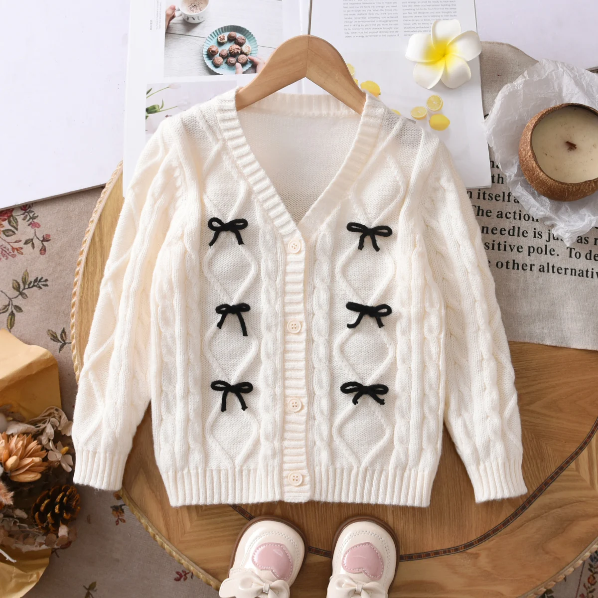 Girls' sweet solid color Fried Dough Twists bow V-neck long sleeved sweater cardigan suitable for daily leisure