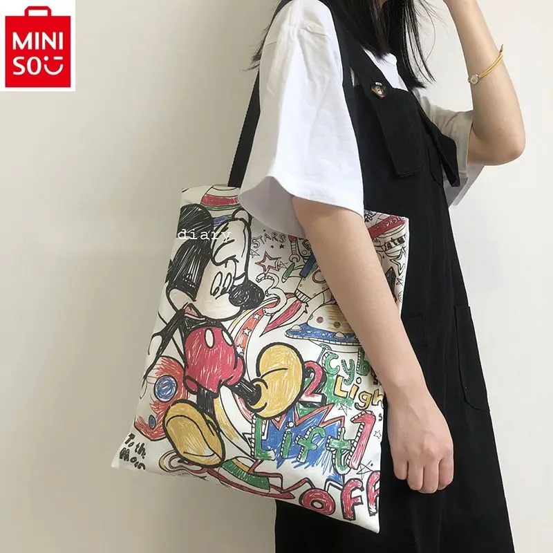 

MINISO Disney High Quality Graffiti Canvas Bag for Women Cartoon Mickey Large Capacity Casual Versatile Handheld Tote Bag