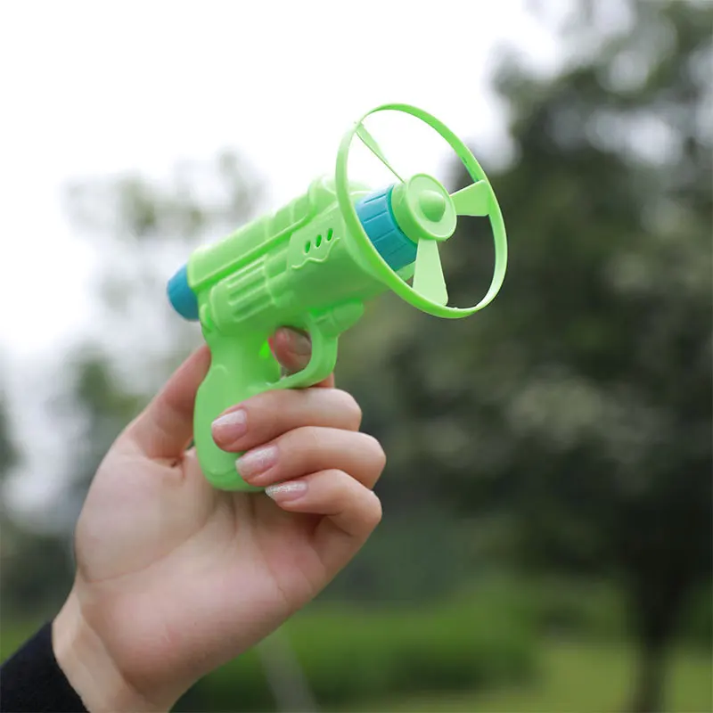 1PCS Flying Bamboo Dragonfly Flying Saucer Gun Pistol Bamboo Dragonfly Flying Disc Top Outdoor Children Toy Launch Flying Fairy