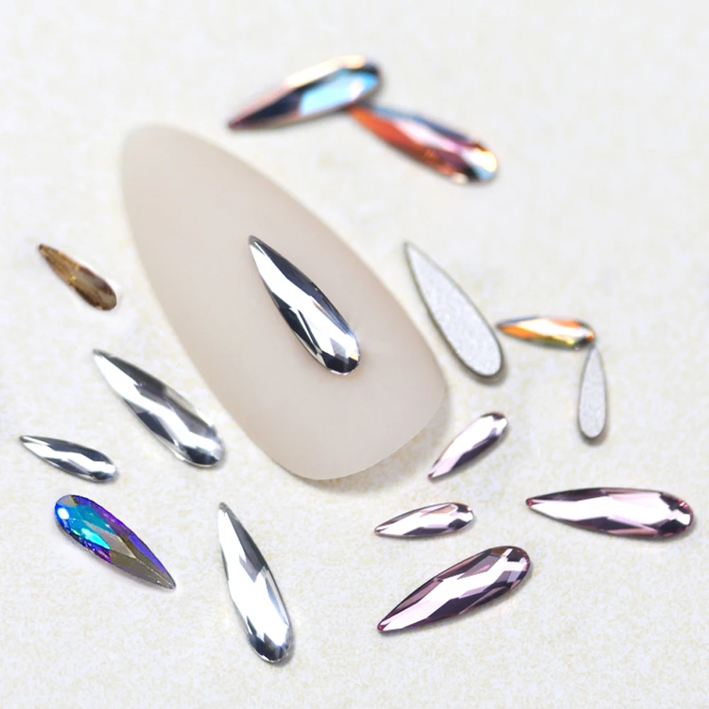 100 adet Strass 2X6mm 3x10mm Kristal AB Kırmızı Mavi Damla Unicorn Şekilli Elmas Tasarım Rhinestones 3D DIY Tırnak Sanat Dekorasyon