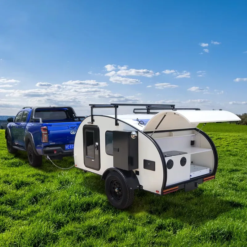 Small off-road camper trailer with independent suspension with electric brakes for camping and tent kitchens