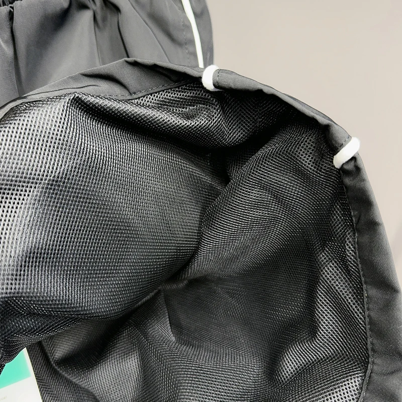 黒刺繍コスモススターリングバスケットボールショーツメッシュ速乾性 Jorts 男性女性ルーズ巾着ウインドブレーカースポーツショートパンツ