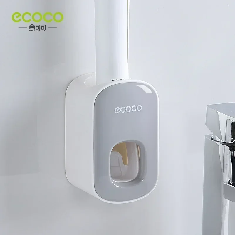 ECOCO Fully automatic toothpaste squeezing suction wall mounted squeezer for household non perforated toothbrush storage rack