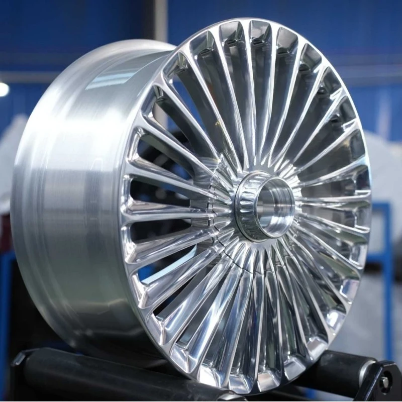 Polished multi-spoke wheels, bright silver metal texture, suitable for high-end cars