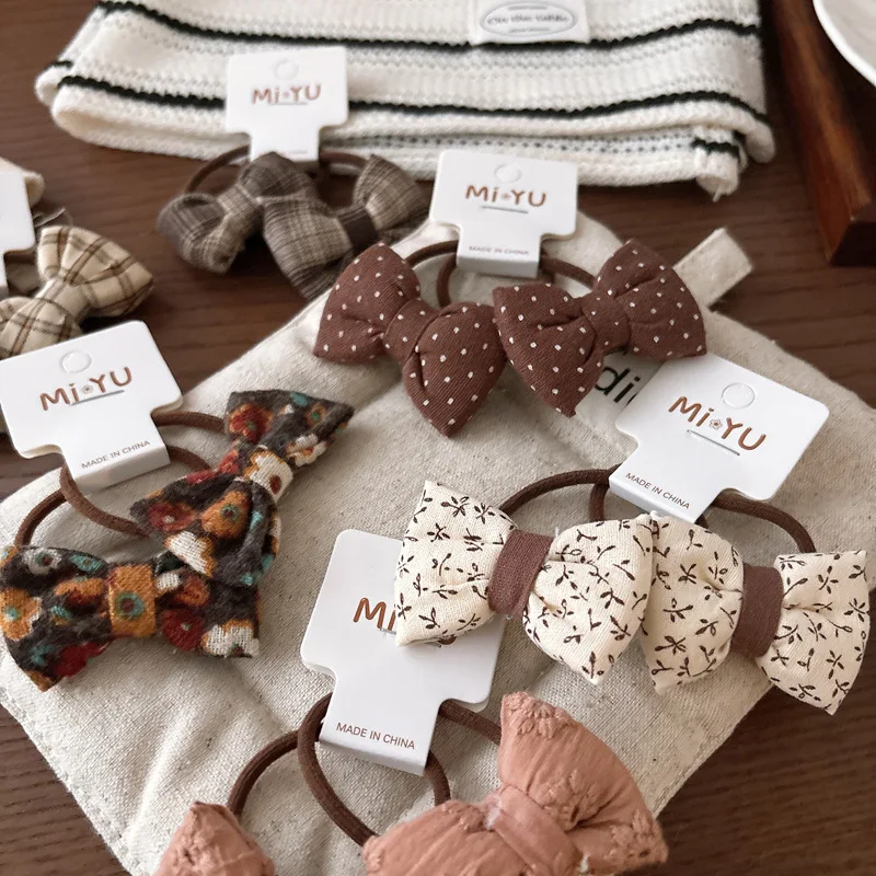 

2pcs/set Korean Kids Bow Hair Ties Sweet Beige Fabric Elastic with Polka Dot Floral Pattern Double Twisted Hair Bands for Girl