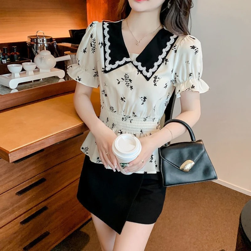 

Летняя модная женская шифоновая блузка 2026 года с коротким рукавом, приталенная, укороченная, с воротником «кукла» и цветочным узором