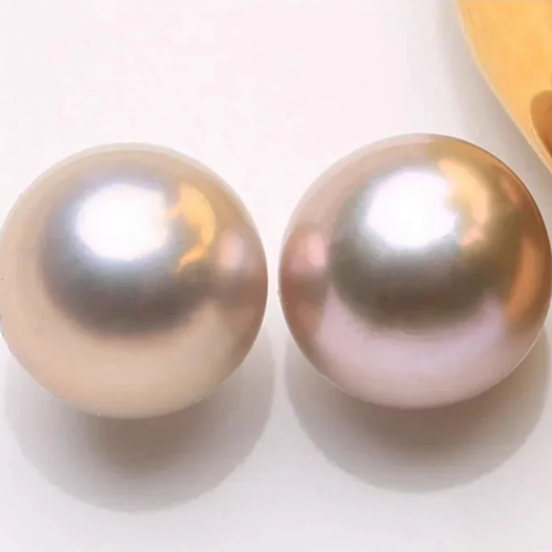 

PAIR OF 13-14MM SOUTH SEA GOLD PINK FLAT BOTTOM PEARL HALF DRILLED