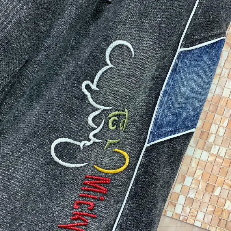 Trendige Marken-Jeans im amerikanischen Stil für Frühling/Sommer: Schwerer Patchwork-Farbblock mit Cartoon-Motiven, gerade geschnitten, schlank machend, lässige lange Denim-Hose