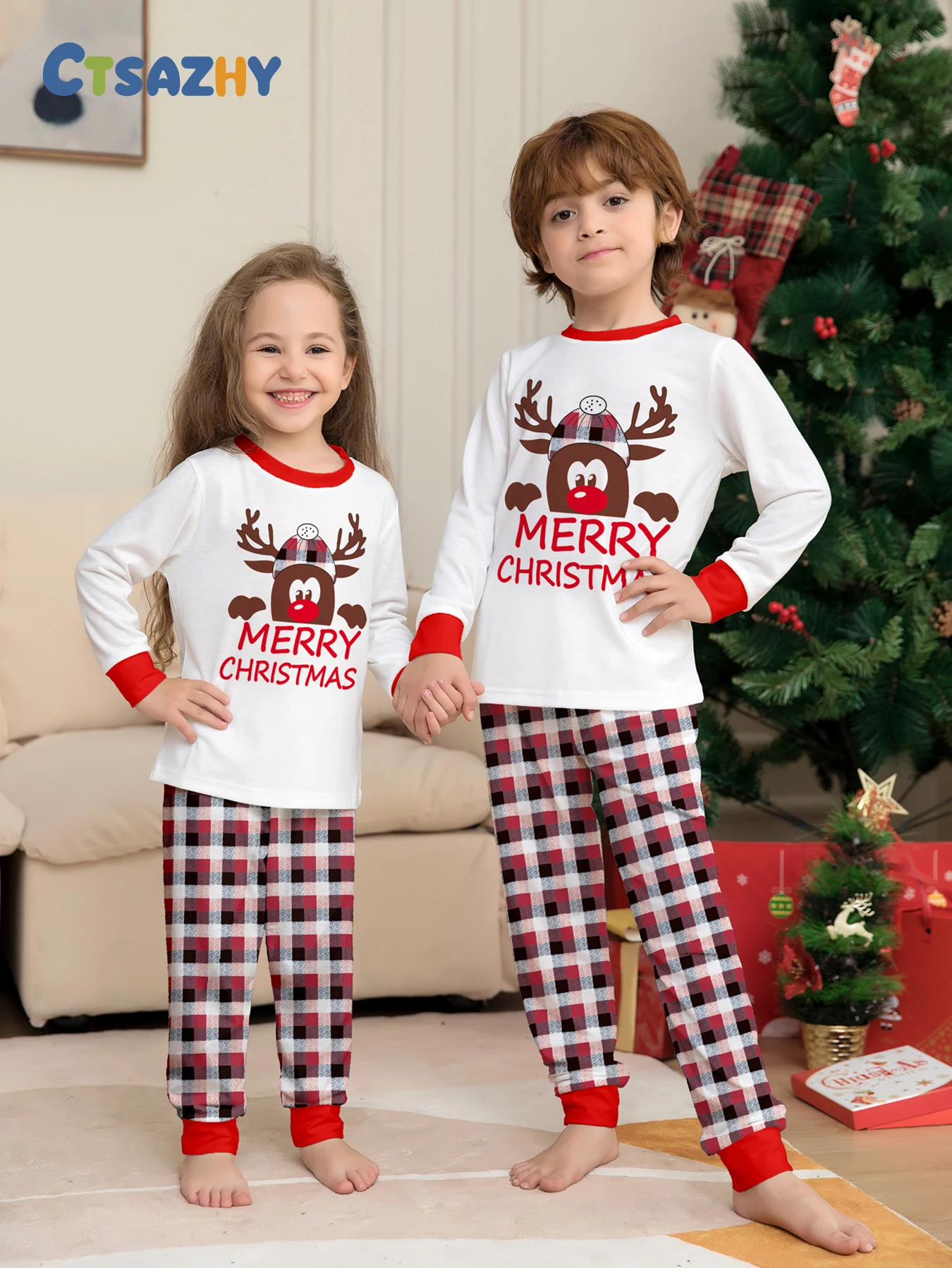 

Festive Unisex Children's Sleepwear - White Xmas PJs with Reindeer, “MERRY CHRISTMAS” Prints + Plaid Bottoms