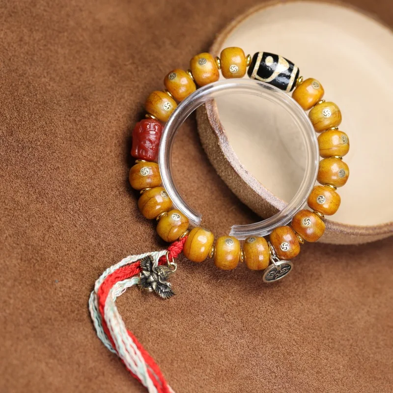 Yak bone inlaid swastika fortune bucket bracelet, ornamental piece with big phoenix and turquoise hamburger beads