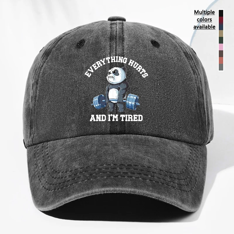 A Unisex Baseball Cap Featuring a Vintage Washed Design with a Lifting Panda Print That Says 'EVERYTHING HURTS AND I'M TIRED'. I