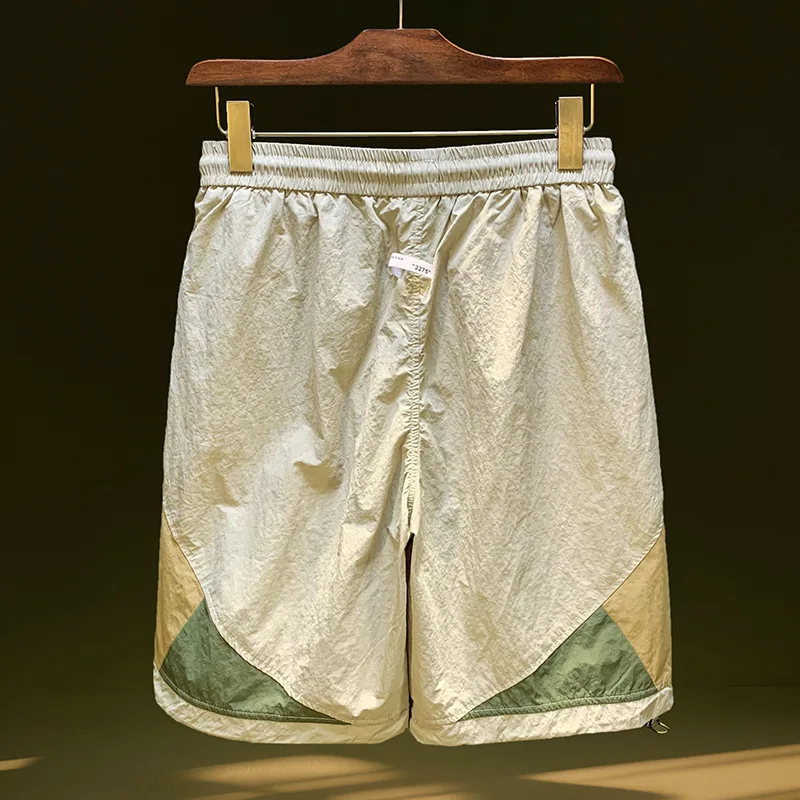 

Быстросохнущие шорты сращивания цветов для мужских модных летних тонких, свободных, эластичных, дышащих пляжных спортивных брюк на открытом воздухе