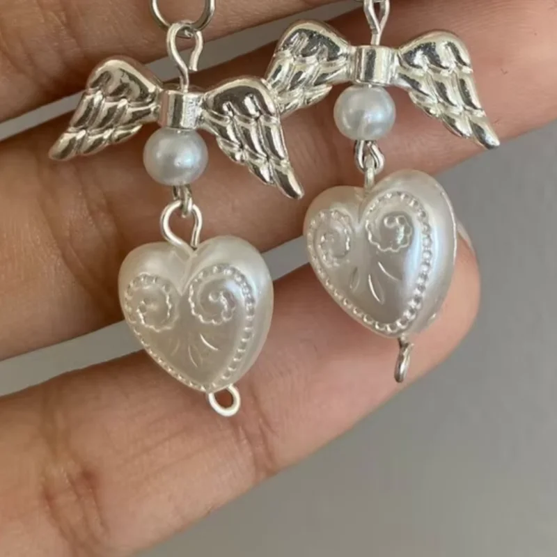 white coquette pearl angel earrings
