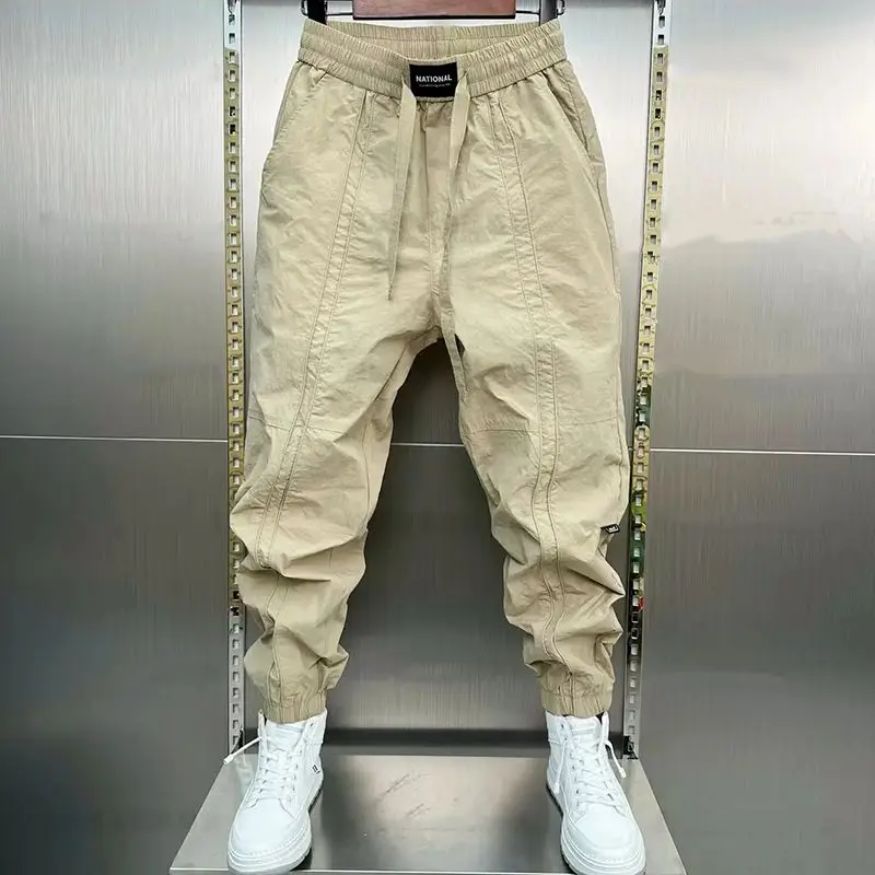 

Spring Summer New Solid Color Fashion Elastic Waist Ankle Length Pants Man High Street Pockets Drawstring Patchwork Trousers